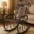 Wooden and iron rocking chair with carved backrest and antique finish